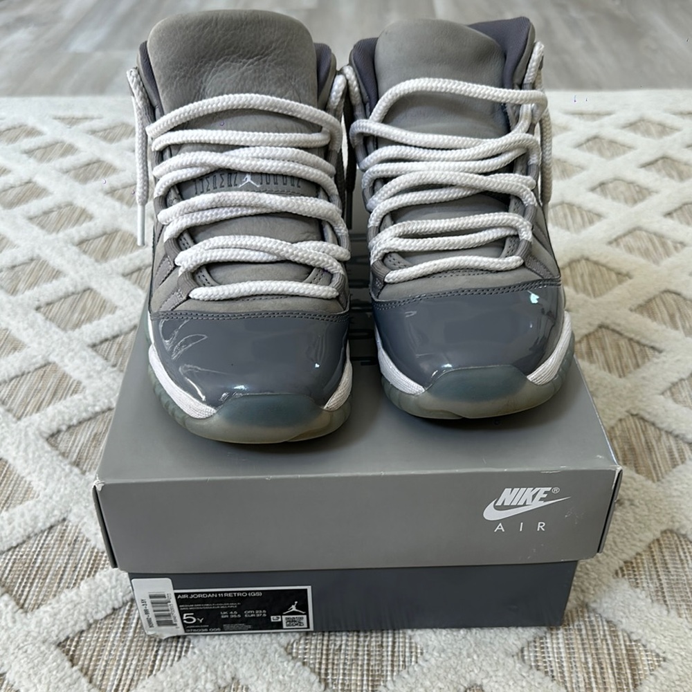 Nike Gray Sneakers with Glossy Finish and Iconic Design